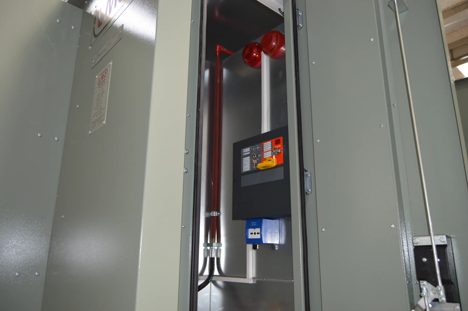 Close-up of electrical controls and protection equipment in LMZ metal kiosk