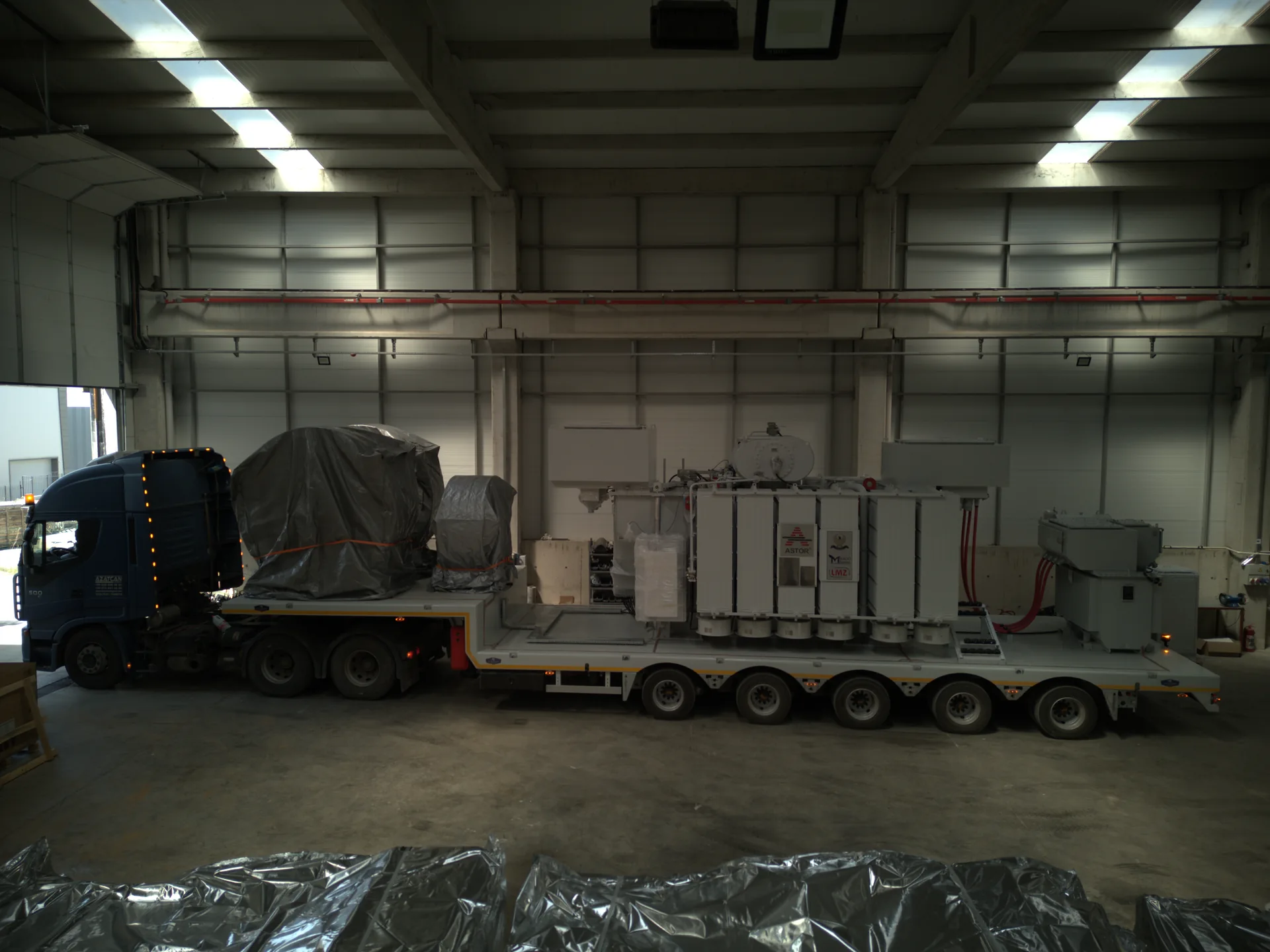 High-angle factory view of LMZ MV/MV transport trailer with electrical equipment