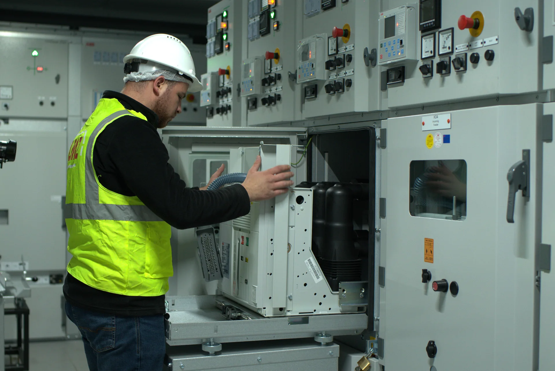LMZ technical personnel working on a mobile substation switchgear cabinet