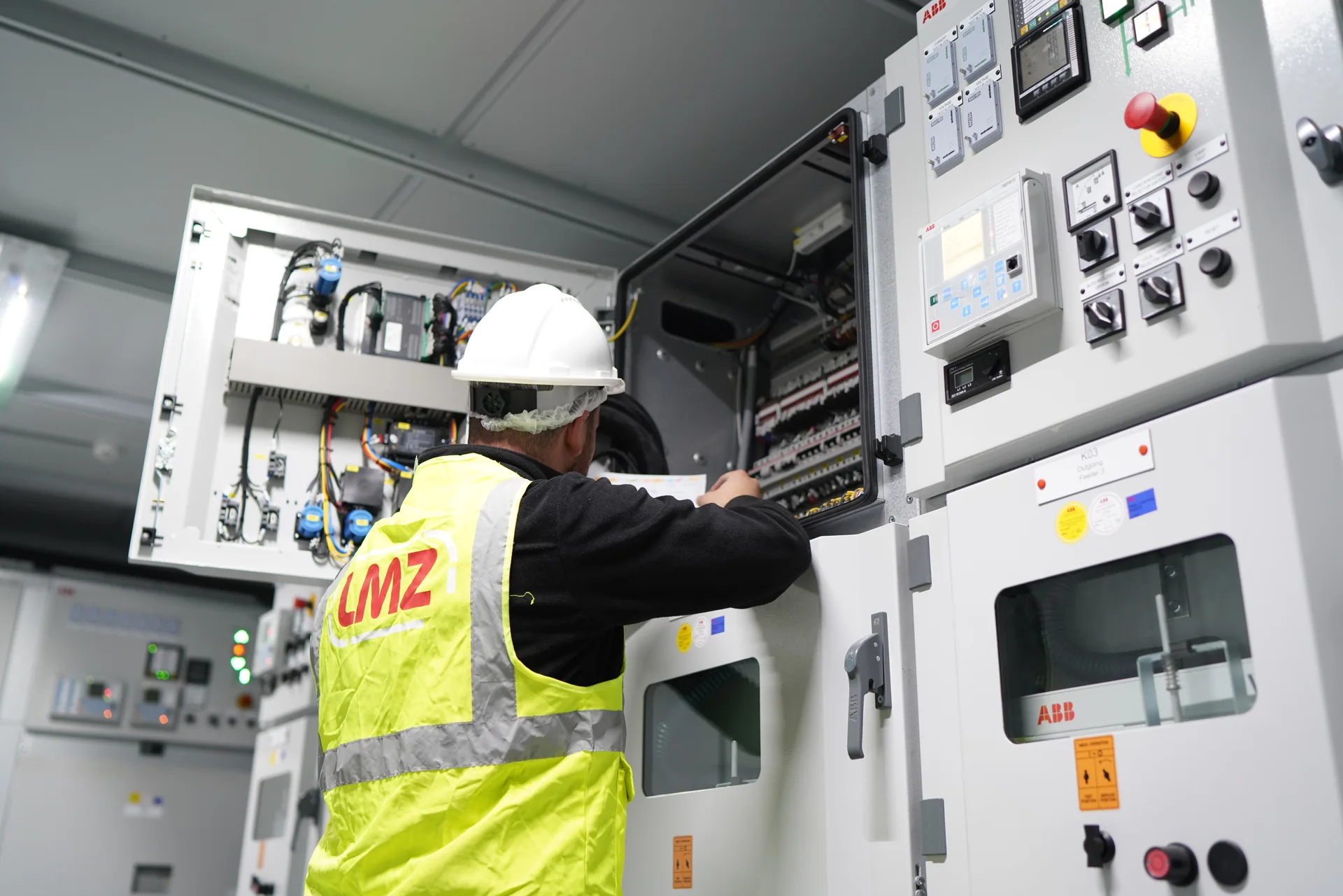 LMZ engineer working on medium-voltage switchgear within a mobile substation